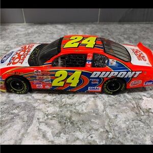 Brand new Jeff Gordon nascar DuPont #24 1:24 scale stock car. Trunk lid lifts up